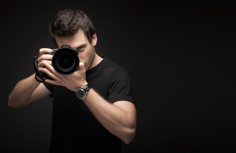 Portrait of a photographer in a glass melting furnace