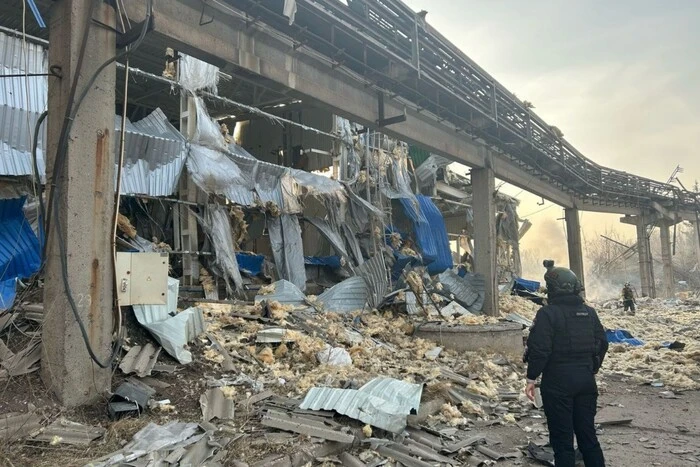 The body of a child under the rubble of a house