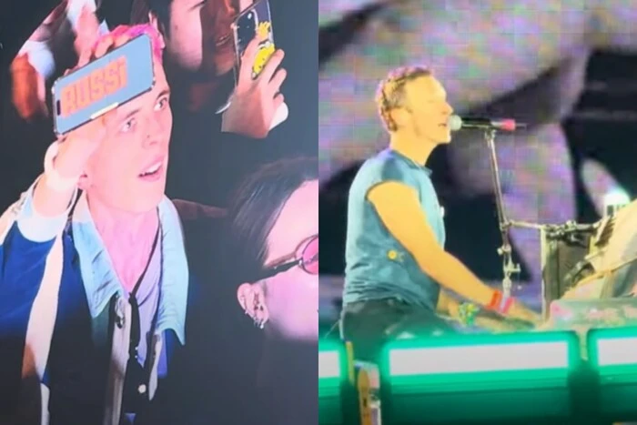 Coldplay performing on stage