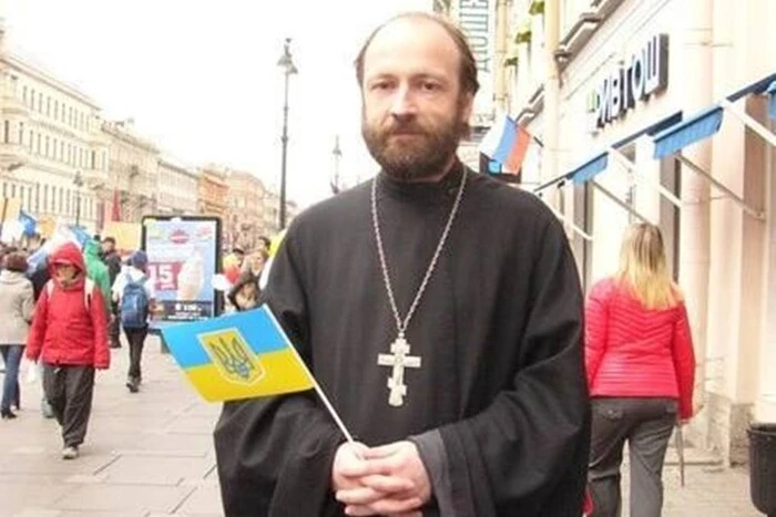 Priest under arrest with Ukrainian flag