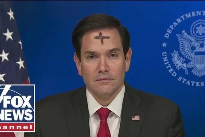 U.S. Secretary of State with inscription on his forehead