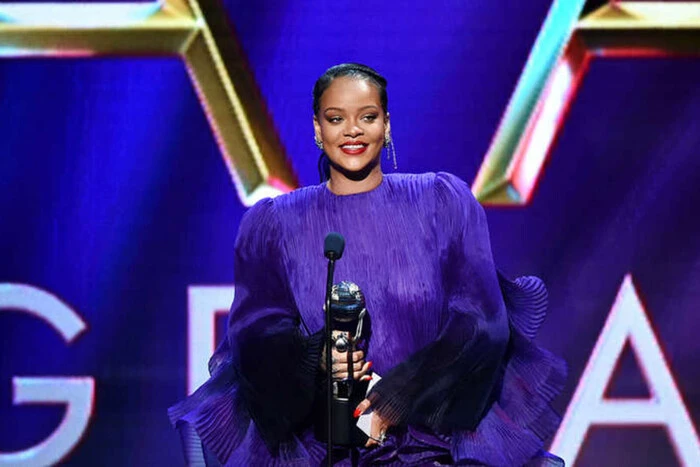 Rihanna holding a microphone