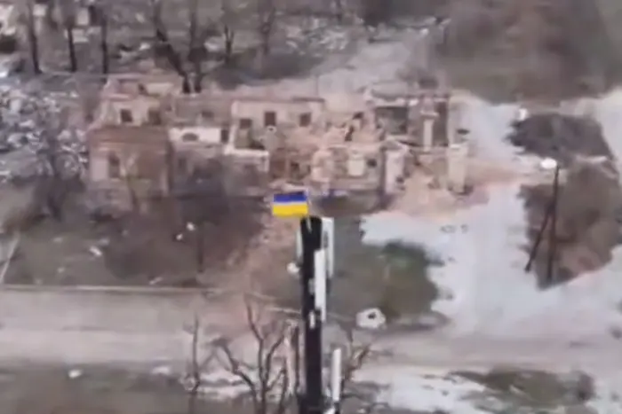 National Guardsmen attach the Ukrainian flag in the enemy's rear