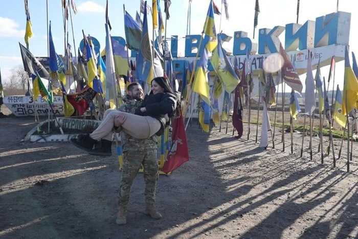 A soldier with a paddle on his knees