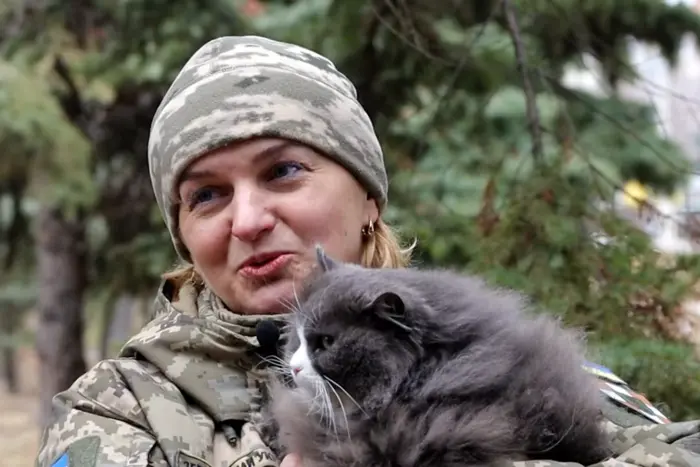 A Volhynian woman with a cat mobilizes to the army