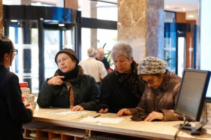 Tourists in line for a hotel