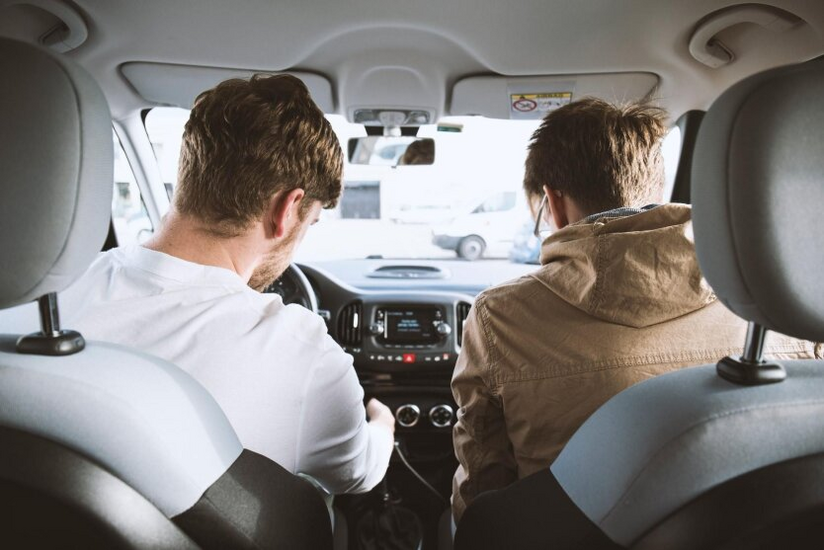 Young driver holds documents in hands