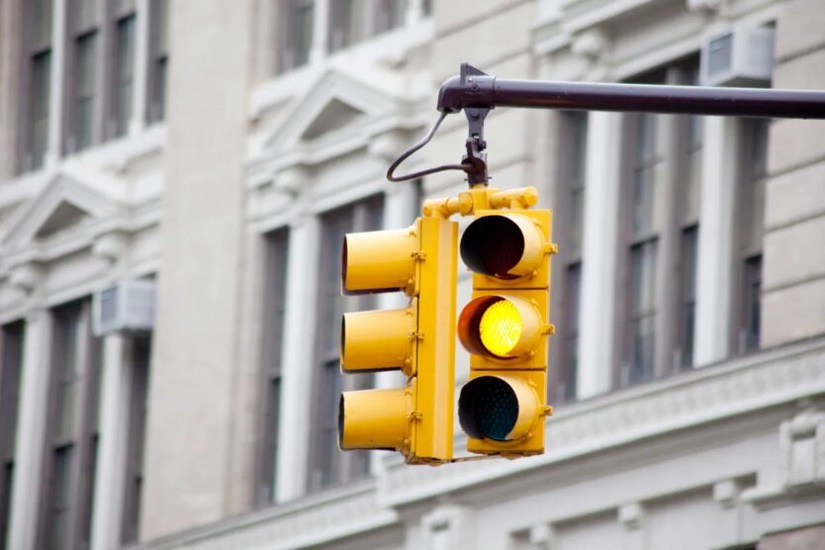 A driver passing on red receives a fine