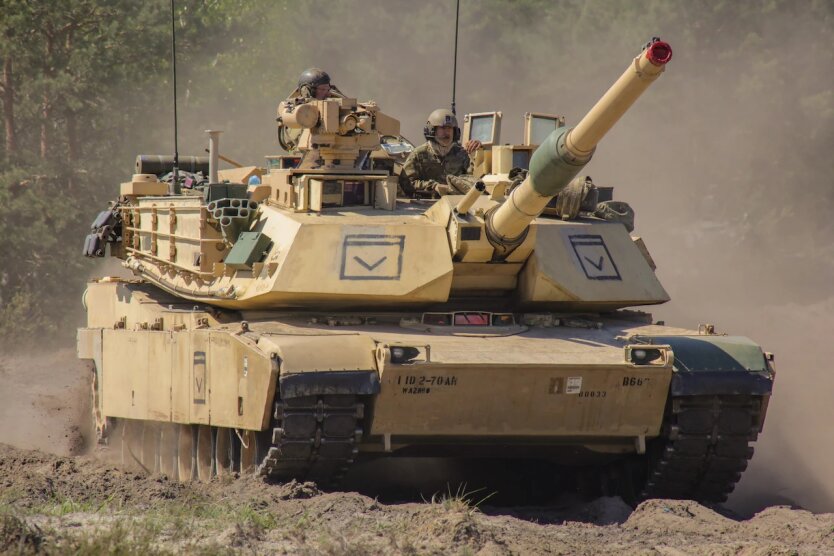 The T-72 tank is located near the American Abrams tank